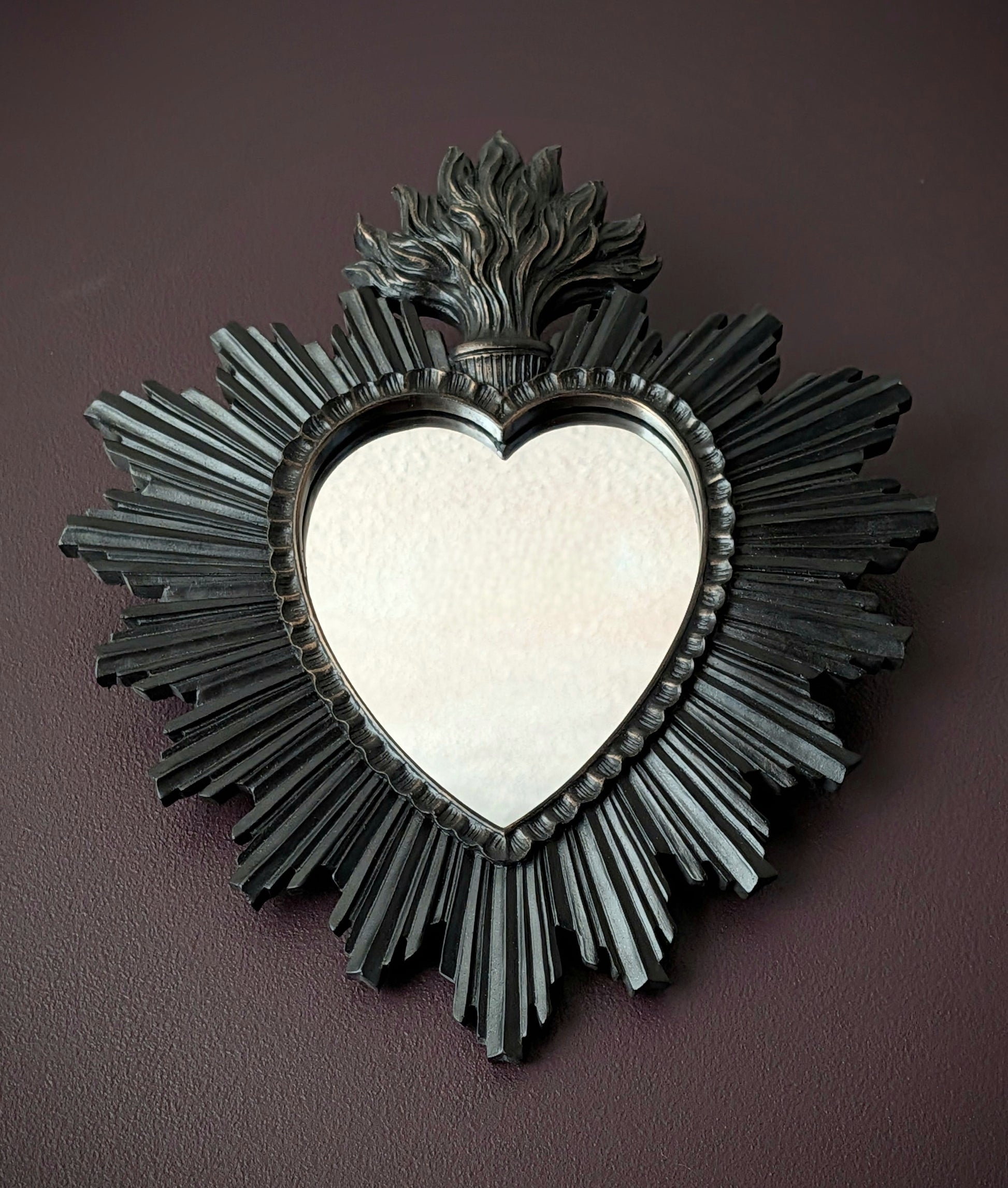 Black mirror shaped like a sacred heart 