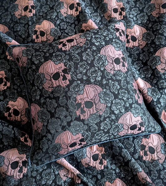 Skull and rose woven fabric cushion on top of a matching throw 